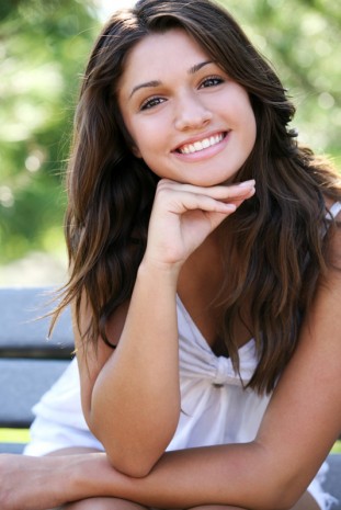 Young  happy girl posing outdoor.